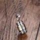 Collier souvenir + pendentif bouddhiste mantra "Om Mani Padme Hum"