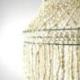 Grand lustre chandelier blanc en véritables coquillages cauris 100cm